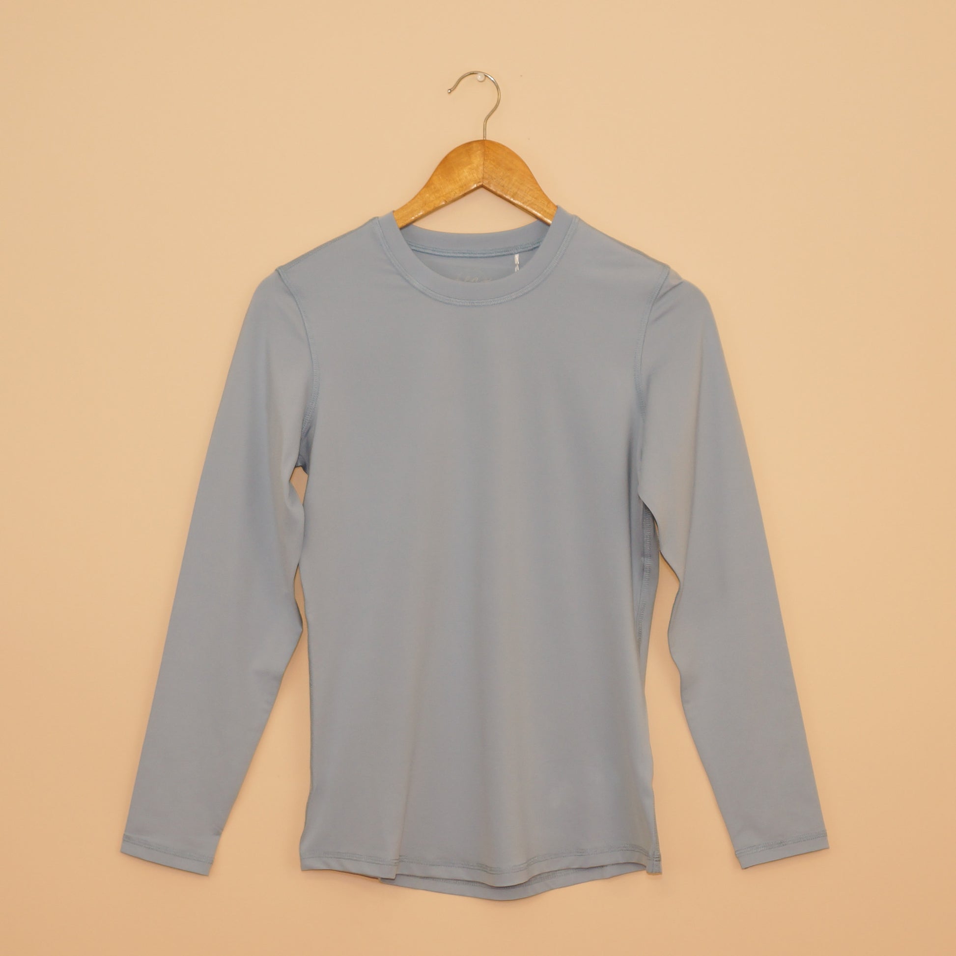 Fog Blue UPF 50+ Long Sleeve Performance Shirt by EA Limited Inc., offering a versatile and fashionable choice for reliable sun protection during outdoor pursuits.