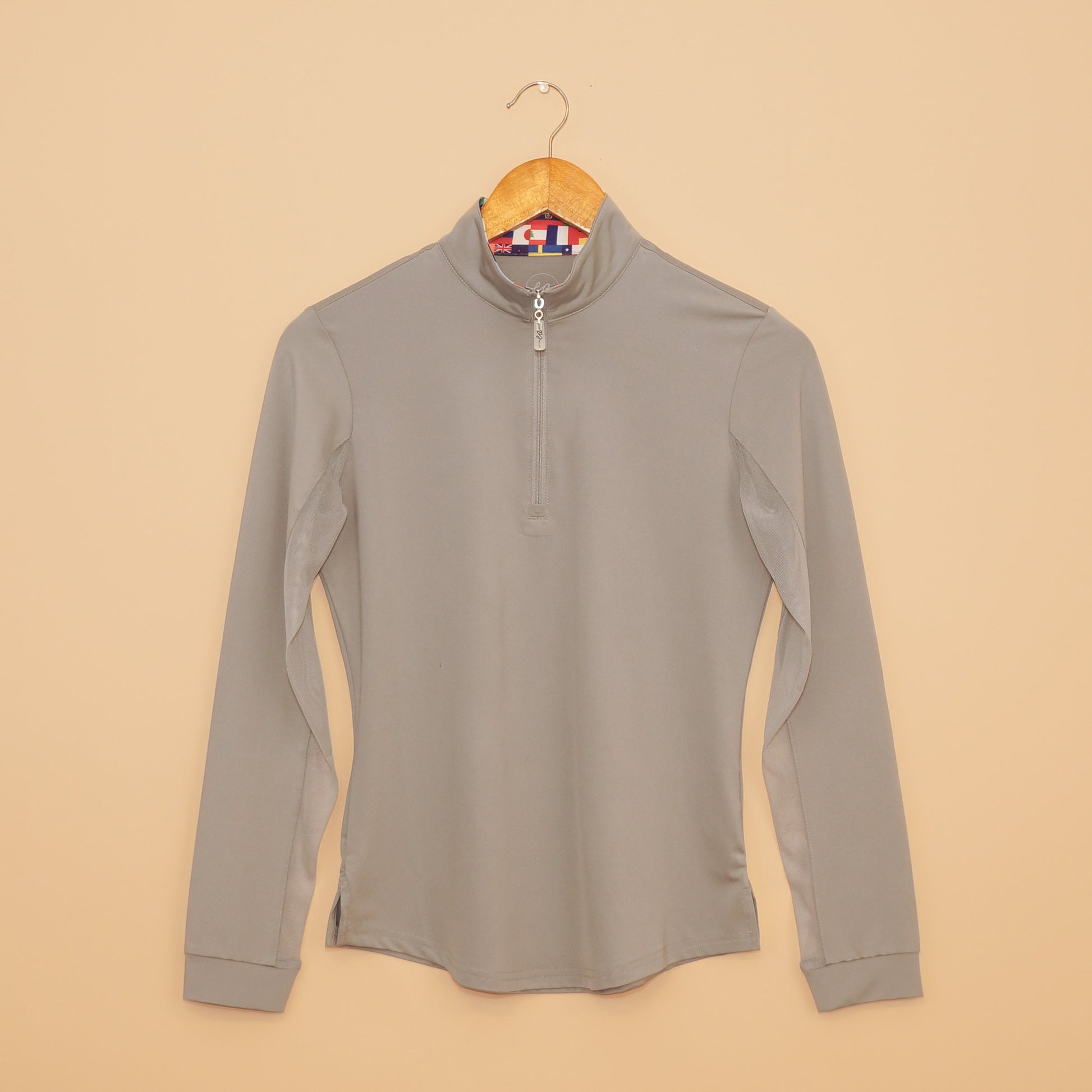 EA Limited Inc. International Sun Shirt in sleek gray with UPF 50+ protection, quarter-zip design, and a unique collar featuring a vibrant print of international flags on the inside.