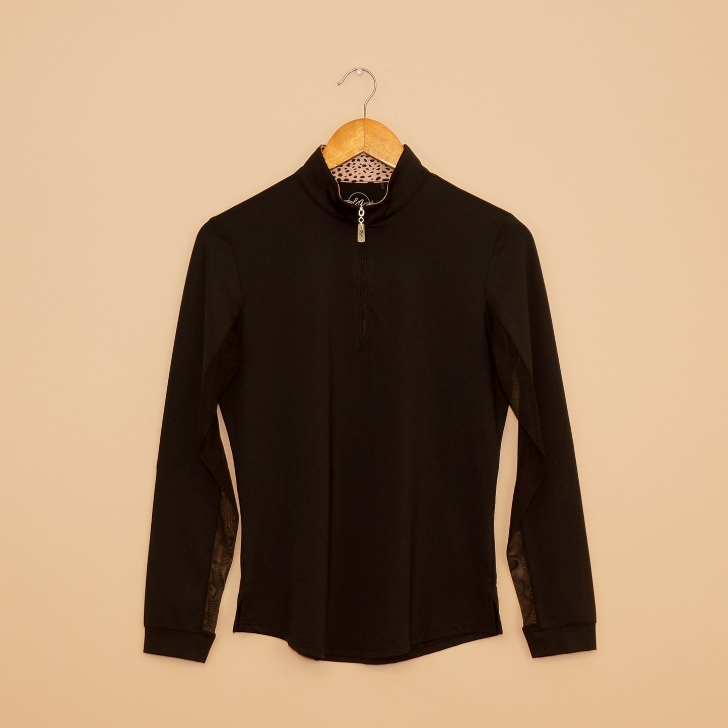 Black Wild Thing Sun Shirt by EA Limited Inc. with a quarter-zip design, UPF 50+ protection, and a hidden leopard print detail inside the collar.