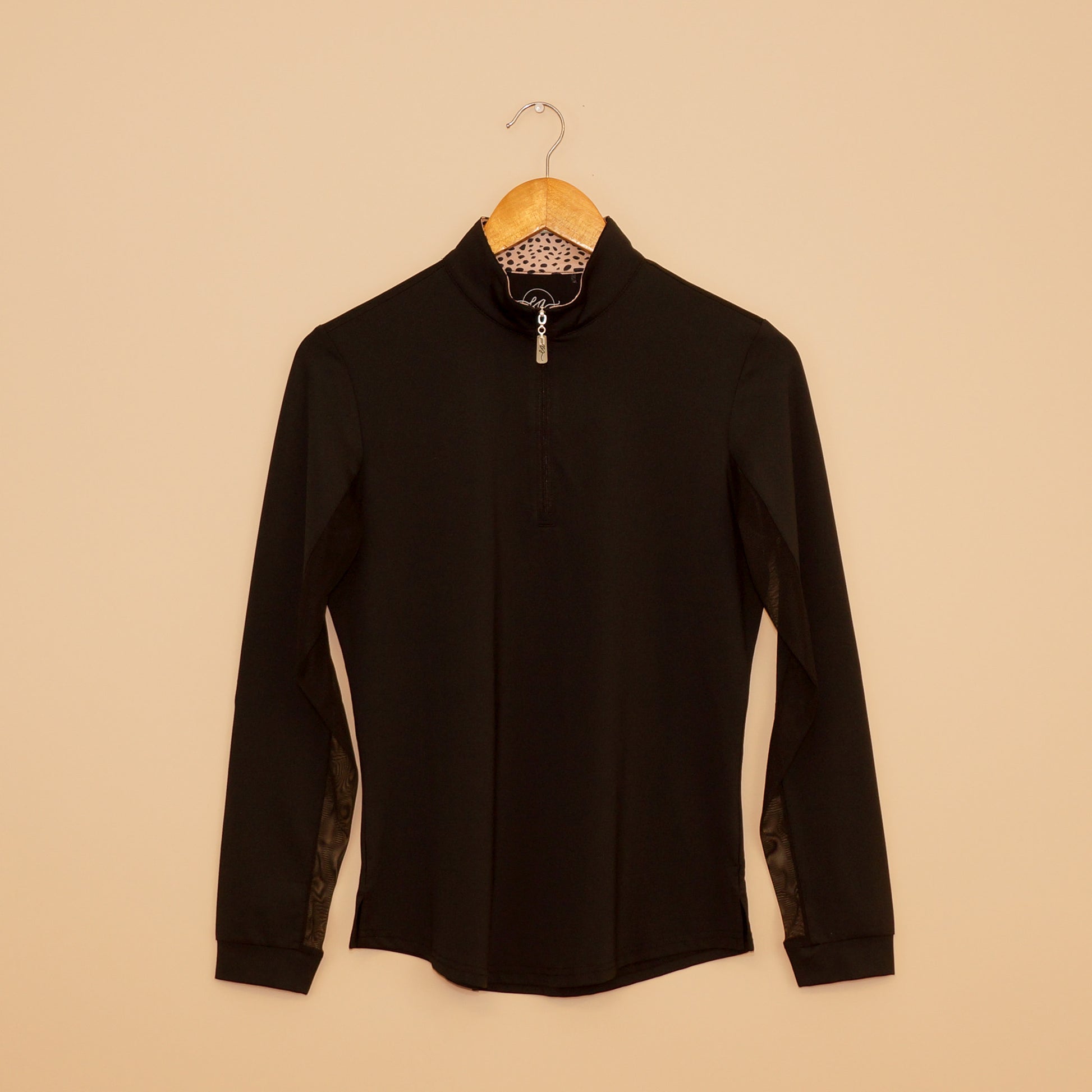 Black Wild Thing Sun Shirt by EA Limited Inc. with a quarter-zip design, UPF 50+ protection, and a hidden leopard print detail inside the collar.